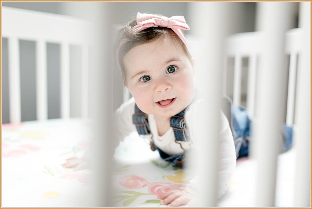 Six Month Baby Photography in pink crib by Walker Studios LLC in Connecticut